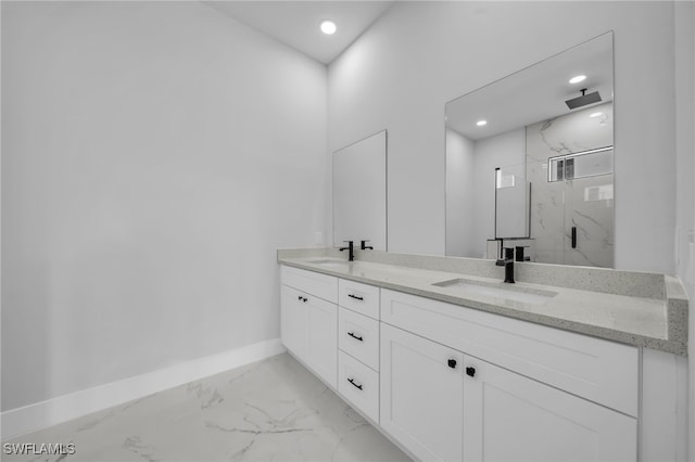 full bath featuring a marble finish shower, marble finish floor, baseboards, and a sink