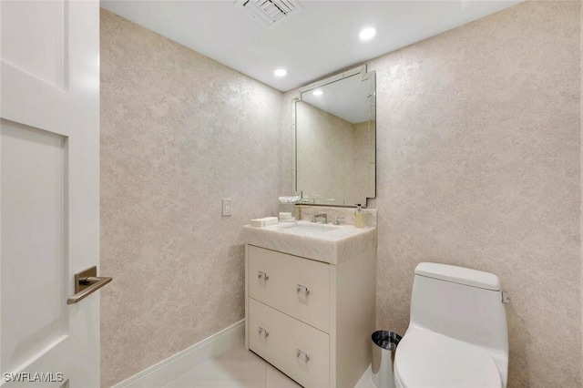 bathroom featuring toilet, recessed lighting, vanity, visible vents, and tile patterned floors