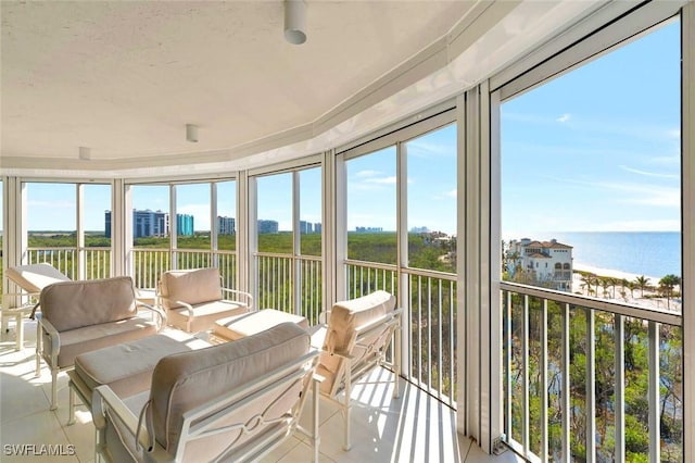 sunroom with a water view