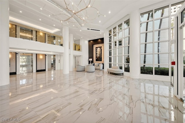 8111 Bay Colony Dr Unit 701, Naples, FL 34108 - building lobby featuring a towering ceiling