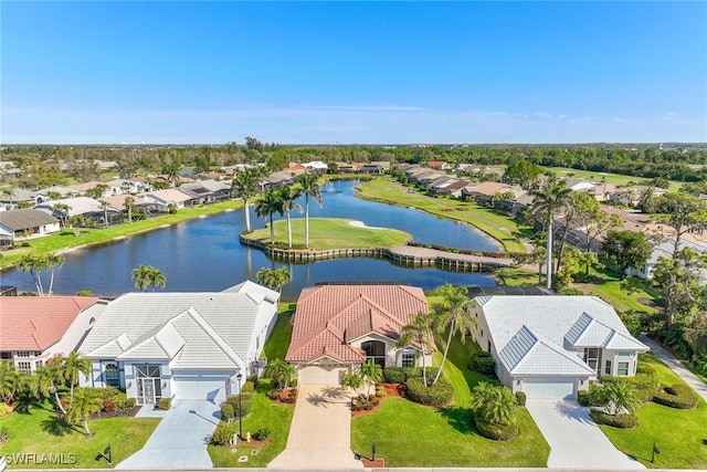 bird's eye view with a residential view and a water view