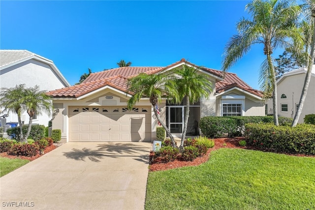 mediterranean / spanish-style house with a tiled roof, an attached garage, driveway, and stucco siding