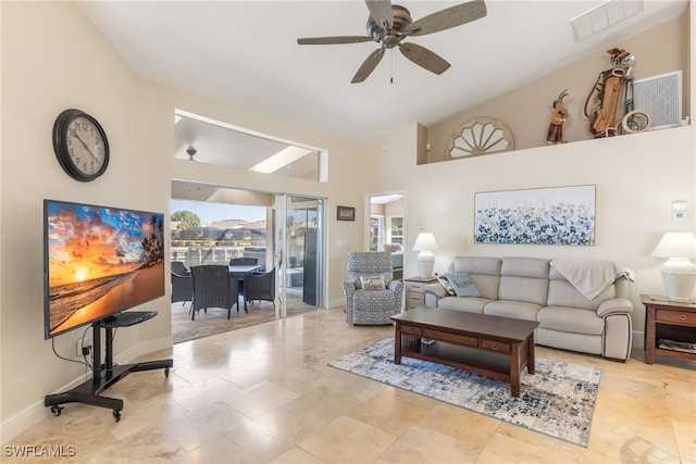 living room featuring ceiling fan, high vaulted ceiling, visible vents, and baseboards