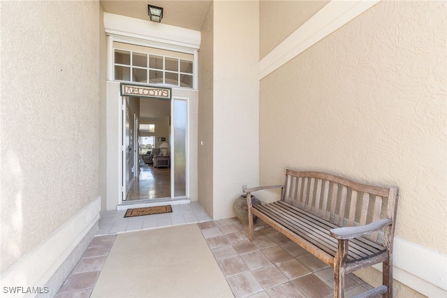 entrance to property with stucco siding