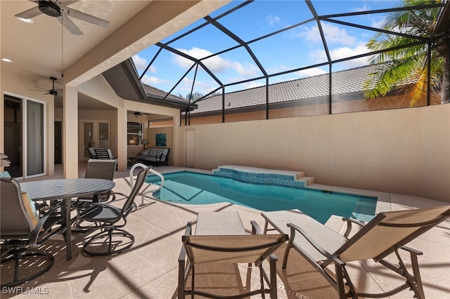 pool with ceiling fan, a patio area, and a lanai