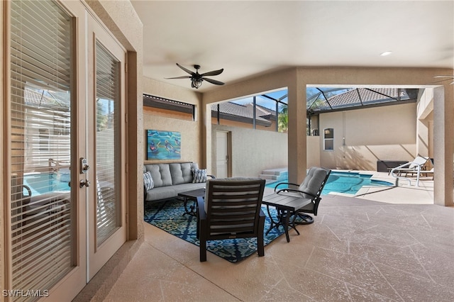 sunroom with a pool and a ceiling fan