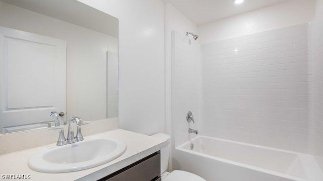 full bath featuring toilet, bathtub / shower combination, and vanity