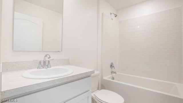 bathroom with shower / bath combination, vanity, and toilet