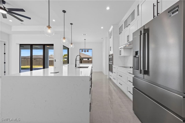 611 NW 25th Ter, Cape Coral, FL 33993 - kitchen with appliances with stainless steel finishes, a ceiling fan, plenty of natural light, a large island, and recessed lighting