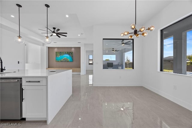 611 NW 25th Ter, Cape Coral, FL 33993 - kitchen with stainless steel dishwasher, white cabinets, ceiling fan, light marble finish flooring, and open floor plan