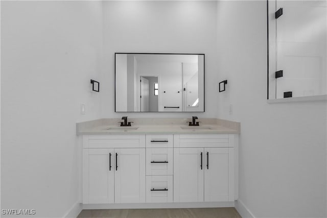 611 NW 25th Ter, Cape Coral, FL 33993 - bathroom with baseboards and double vanity