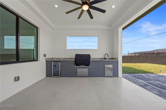 611 NW 25th Ter, Cape Coral, FL 33993 - view of patio / terrace with area for grilling, ceiling fan, and beverage cooler