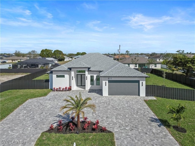 611 NW 25th Ter, Cape Coral, FL 33993 - view of front facade with stucco siding, a garage, roof with shingles, a residential view, and decorative driveway
