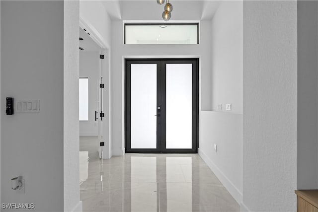611 NW 25th Ter, Cape Coral, FL 33993 - foyer entrance with baseboards and french doors
