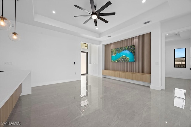 611 NW 25th Ter, Cape Coral, FL 33993 - unfurnished room featuring light marble finish flooring, a ceiling fan, recessed lighting, and a tray ceiling