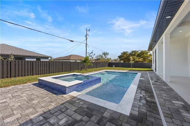 611 NW 25th Ter, Cape Coral, FL 33993 - view of pool featuring a patio area, a fenced backyard, and a pool with connected hot tub