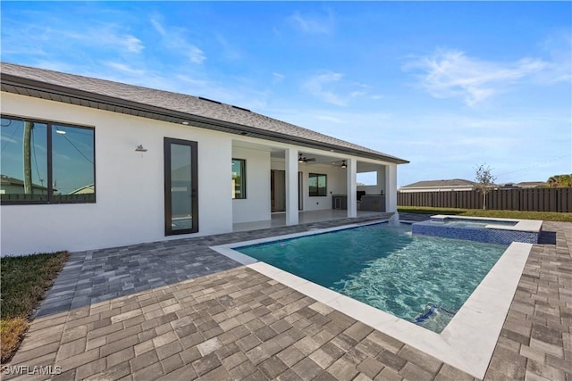 611 NW 25th Ter, Cape Coral, FL 33993 - view of pool featuring a patio area, a ceiling fan, and a pool with connected hot tub