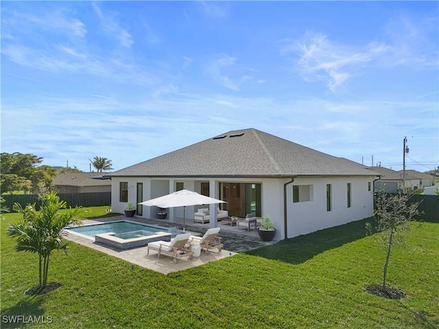 611 NW 25th Ter, Cape Coral, FL 33993 - back of property with a patio area, roof with shingles, stucco siding, and a pool with connected hot tub