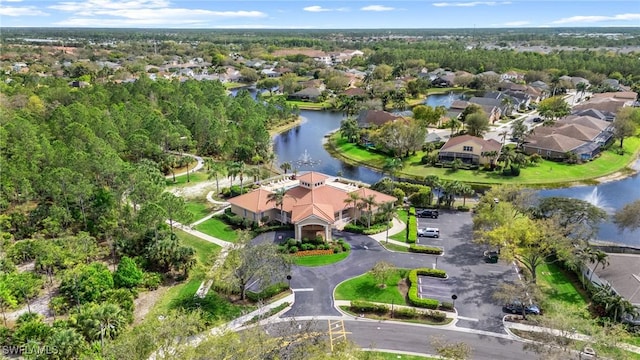 bird's eye view with a residential view and a water view