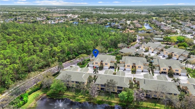 bird's eye view with a residential view and a water view