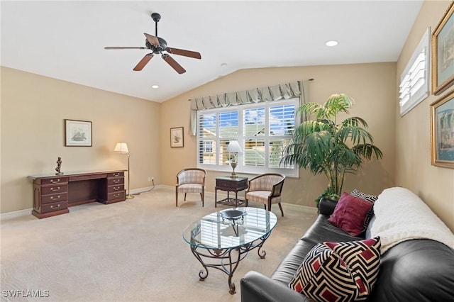 living area with a healthy amount of sunlight, baseboards, carpet flooring, and lofted ceiling