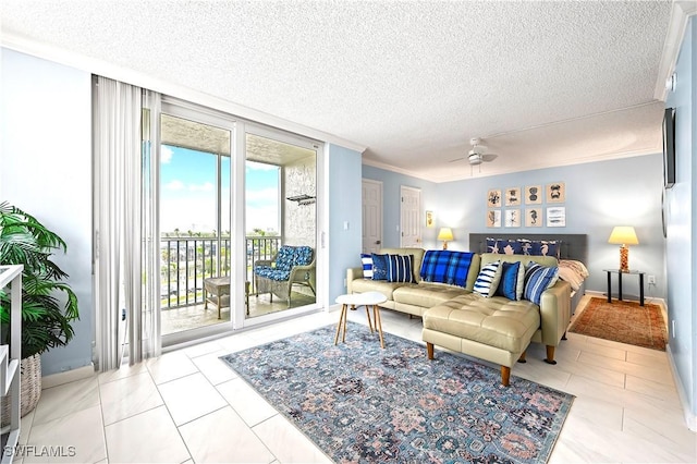 tiled living room with baseboards, a ceiling fan, a wall of windows, a textured ceiling, and crown molding