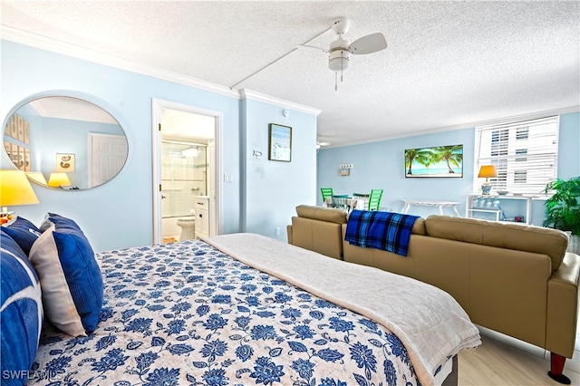 bedroom with crown molding, a textured ceiling, ensuite bath, and ceiling fan