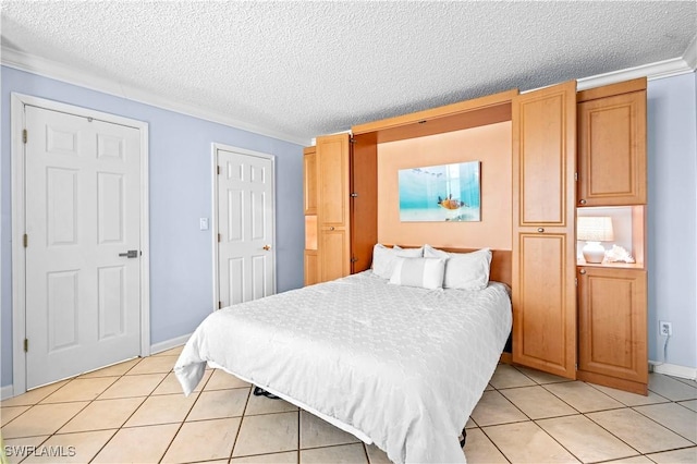 bedroom with light tile patterned floors, baseboards, ornamental molding, and a textured ceiling