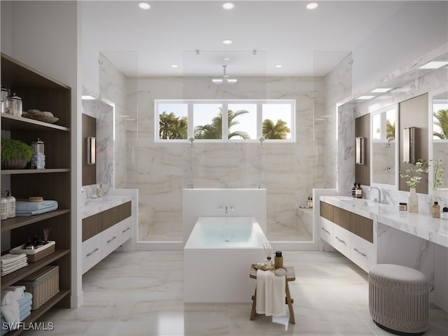 bathroom featuring marble finish floor, two vanities, a marble finish shower, and recessed lighting