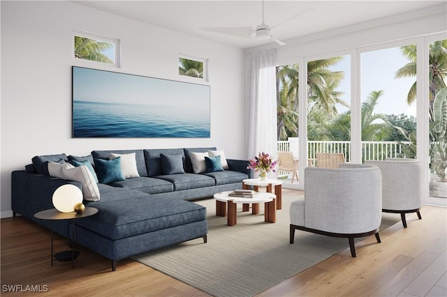 living room featuring ceiling fan and wood finished floors