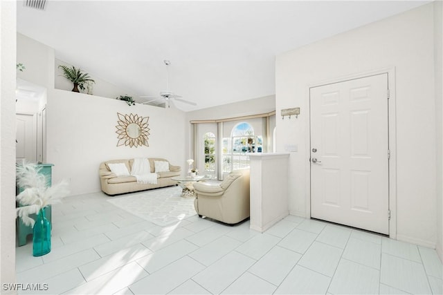 living room with lofted ceiling, light tile patterned flooring, ceiling fan, and visible vents