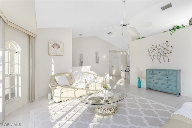 living area with vaulted ceiling, ceiling fan, tile patterned flooring, and visible vents