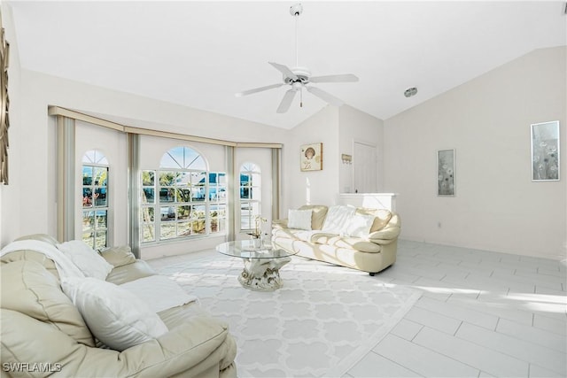 living area featuring a ceiling fan, a wealth of natural light, and lofted ceiling