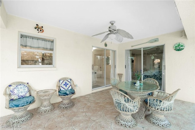 view of patio with ceiling fan and outdoor dining space