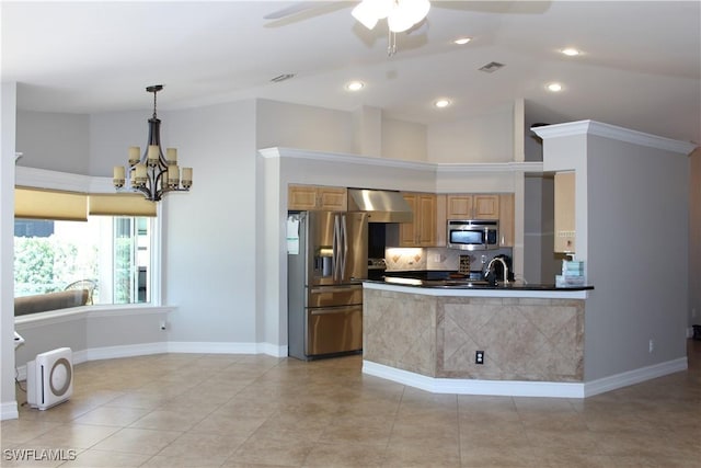 kitchen featuring stainless steel appliances, visible vents, wall chimney range hood, tasteful backsplash, and dark countertops