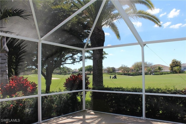 sunroom / solarium with view of golf course