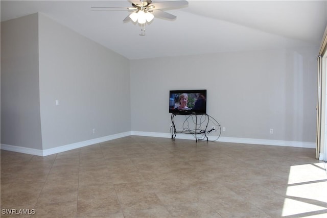 unfurnished living room with vaulted ceiling, ceiling fan, and baseboards