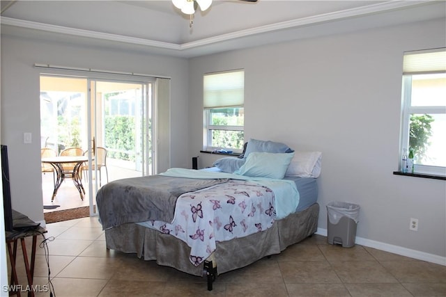 bedroom with baseboards, a raised ceiling, and light tile patterned flooring