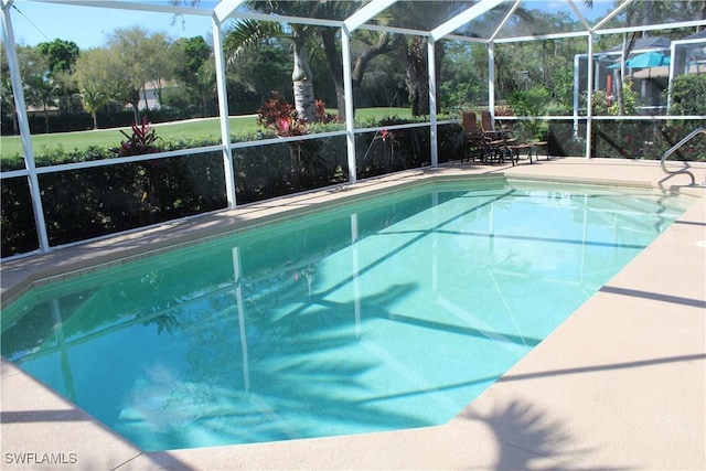 pool featuring a patio area and a lanai