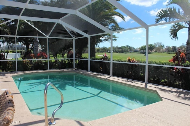 pool with a lanai and a patio area