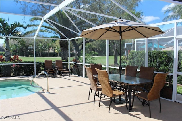 exterior space with glass enclosure and a patio area