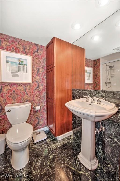 bathroom with marble finish floor, recessed lighting, visible vents, toilet, and wallpapered walls