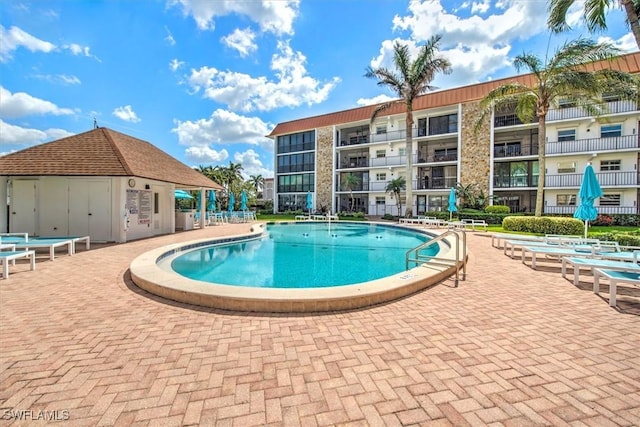 pool with a patio