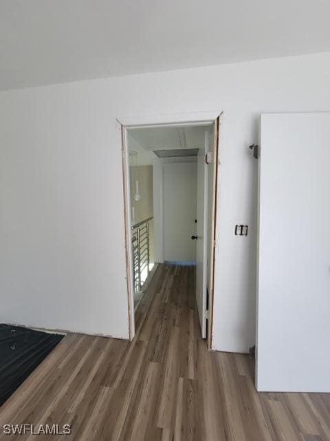 hallway featuring wood finished floors