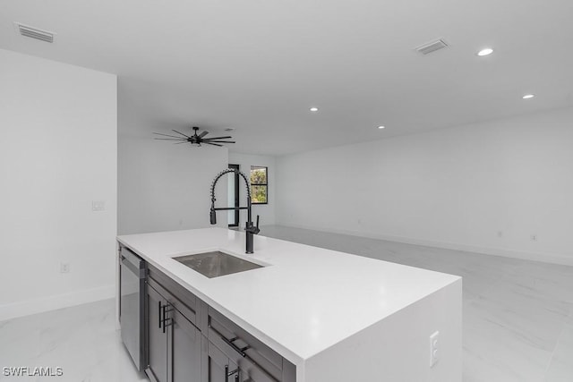 kitchen with open floor plan, stainless steel dishwasher, a sink, and visible vents