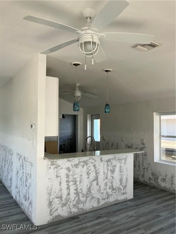 kitchen with white cabinets, visible vents, ceiling fan, and dark wood-style flooring