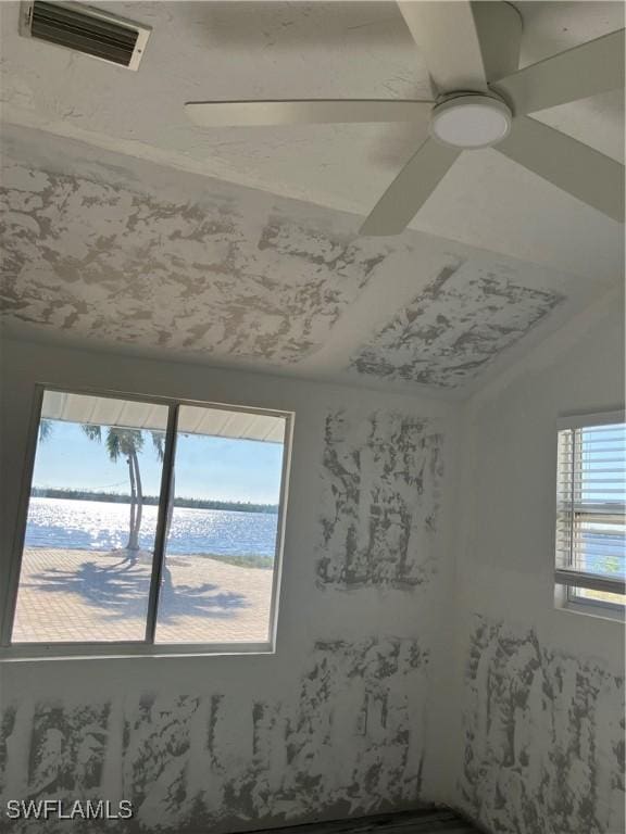 spare room with visible vents and ceiling fan