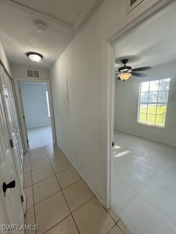 3510 5th St SW, Lehigh Acres, FL 33976 - hall with visible vents and light tile patterned floors
