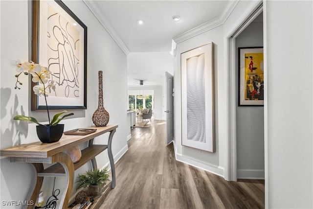 hall with ornamental molding, recessed lighting, baseboards, and wood finished floors