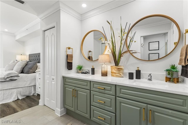 full bathroom featuring connected bathroom, crown molding, a sink, and double vanity